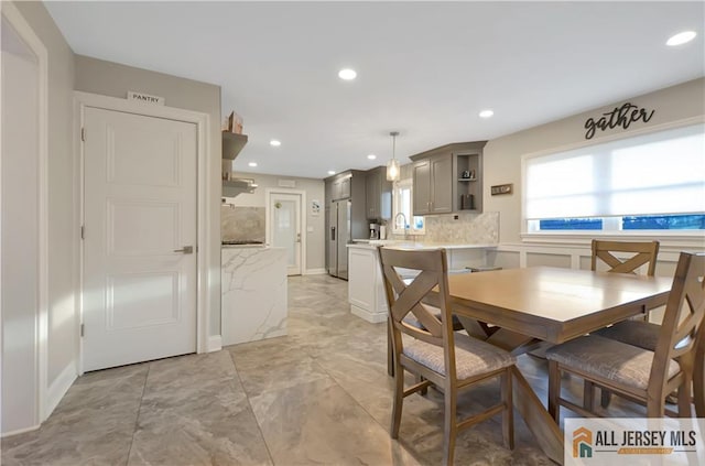 dining space with sink