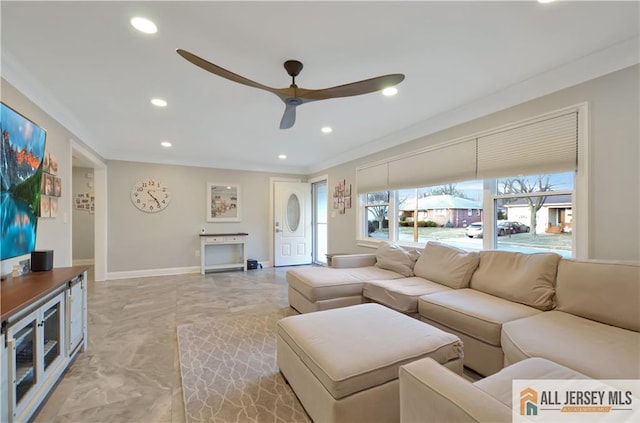 living room with crown molding and ceiling fan