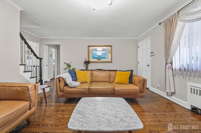 living room with radiator heating unit, ornamental molding, stairway, and dark wood-style flooring