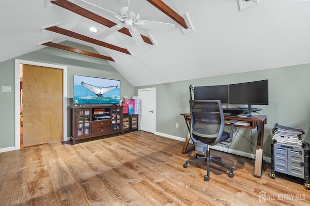 office space featuring visible vents, lofted ceiling with beams, baseboards, and wood finished floors