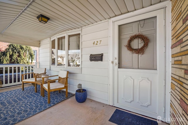 doorway to property featuring a porch