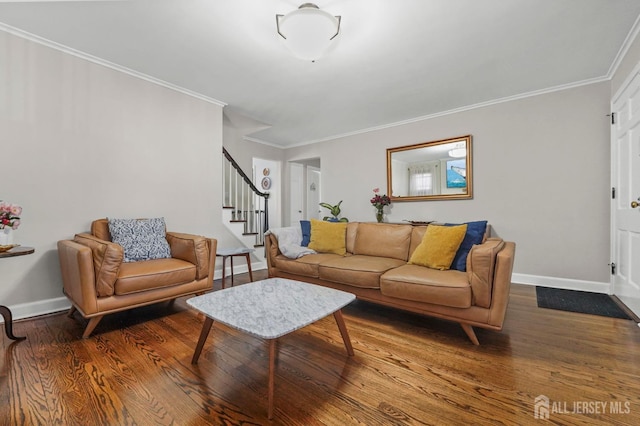 living area with stairs, baseboards, crown molding, and wood finished floors