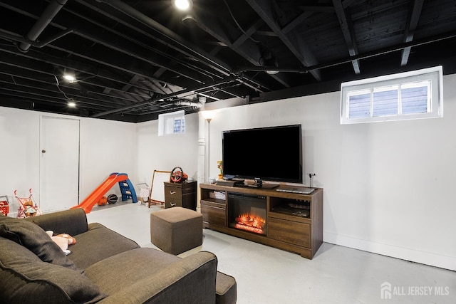 2903 Grasselli Ave, Linden, NJ 07036 - living area featuring finished concrete flooring and baseboards