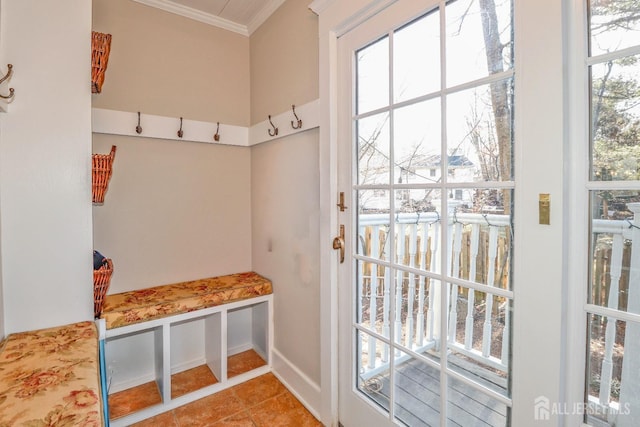 mudroom featuring tile patterned floors and crown molding