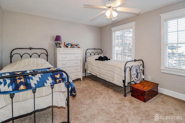 bedroom with carpet flooring, a ceiling fan, and baseboards