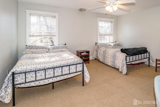 carpeted bedroom featuring a ceiling fan