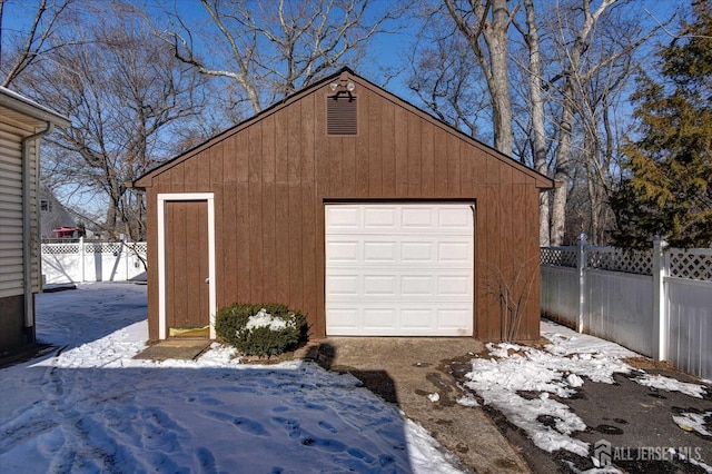 view of snow covered garage