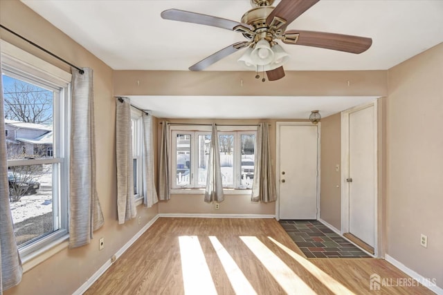 foyer entrance featuring hardwood / wood-style flooring and ceiling fan