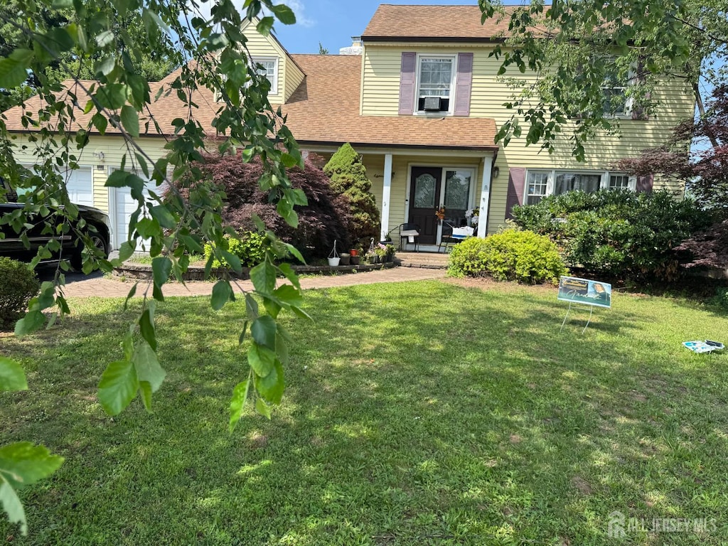 18 High Point Way, Piscataway, NJ 08854 - view of front facade featuring a front yard, covered porch, and roof with shingles