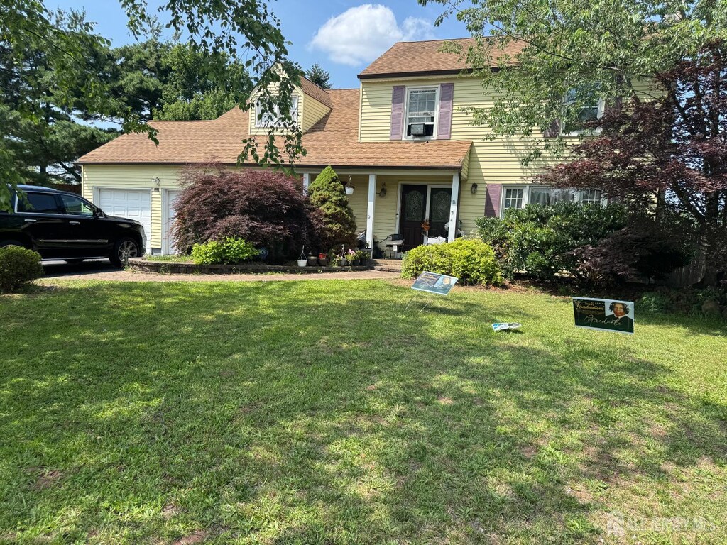 18 High Point Way, Piscataway, NJ 08854 - view of front of home with an attached garage, a front yard, and roof with shingles