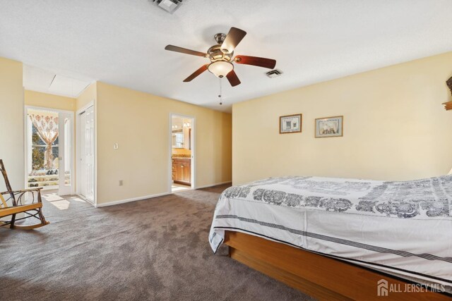 bedroom featuring ensuite bath, ceiling fan, and carpet flooring