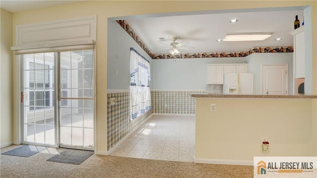 532 Waterside Blvd, Monroe, NJ 08831 - kitchen with white fridge with ice dispenser, a ceiling fan, light carpet, white cabinets, and a peninsula