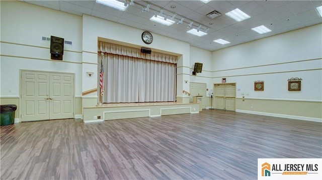 532 Waterside Blvd, Monroe, NJ 08831 - miscellaneous room featuring a paneled ceiling, a towering ceiling, wood finished floors, baseboards, and rail lighting