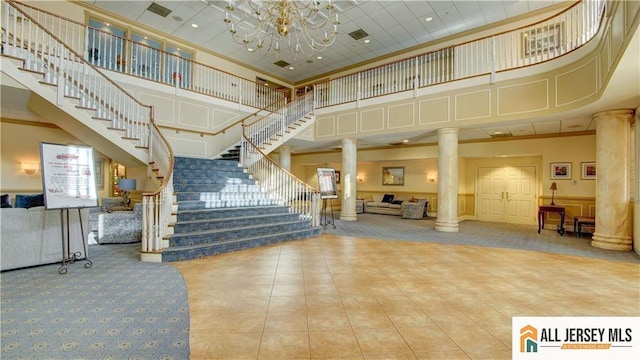532 Waterside Blvd, Monroe, NJ 08831 - common area with a high ceiling, stairs, and wainscoting