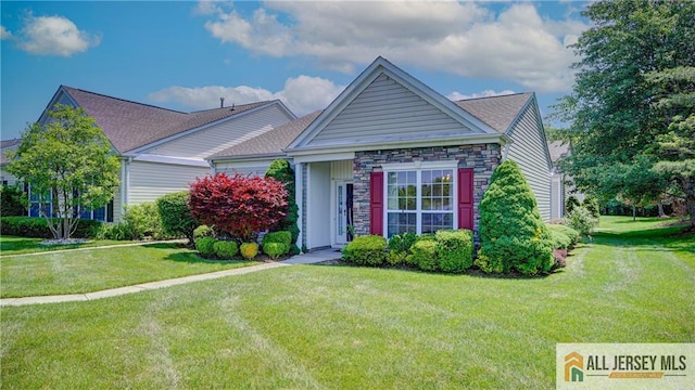 532 Waterside Blvd, Monroe, NJ 08831 - view of front of house featuring a front lawn and stone siding