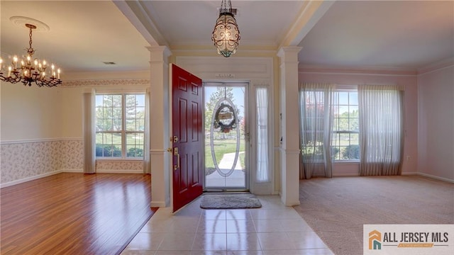532 Waterside Blvd, Monroe, NJ 08831 - entrance foyer with crown molding, plenty of natural light, decorative columns, and a chandelier