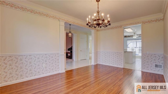 532 Waterside Blvd, Monroe, NJ 08831 - empty room with wood finished floors, wainscoting, wallpapered walls, crown molding, and a chandelier