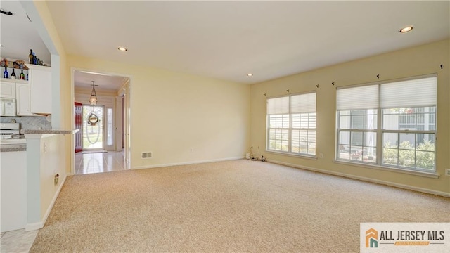 532 Waterside Blvd, Monroe, NJ 08831 - unfurnished living room with light carpet, healthy amount of natural light, recessed lighting, and baseboards