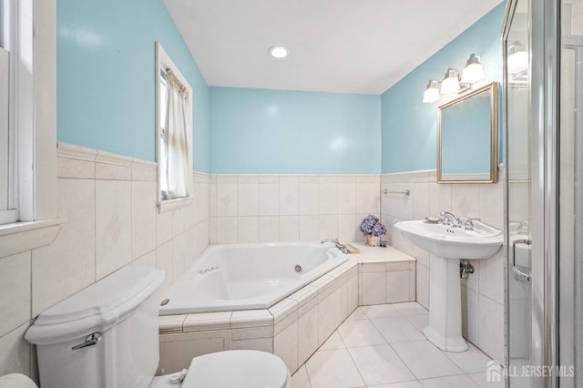 134 Devon Rd, Colonia, NJ 07067 - bathroom with a bath, tile walls, tile patterned floors, and a wainscoted wall