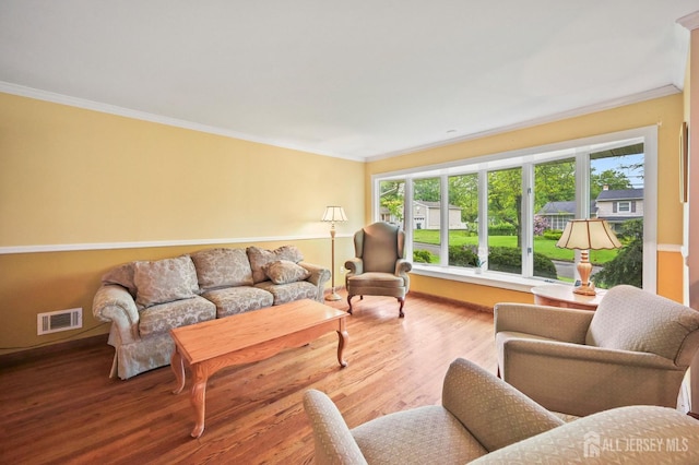 134 Devon Rd, Colonia, NJ 07067 - living area featuring crown molding and wood finished floors