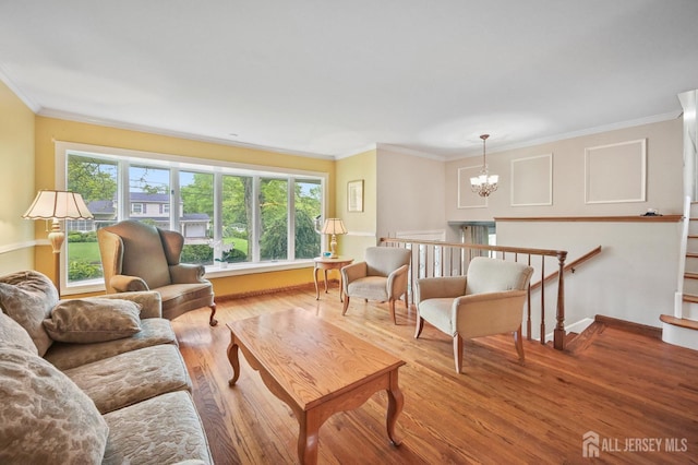134 Devon Rd, Colonia, NJ 07067 - living area with a chandelier, crown molding, and wood finished floors