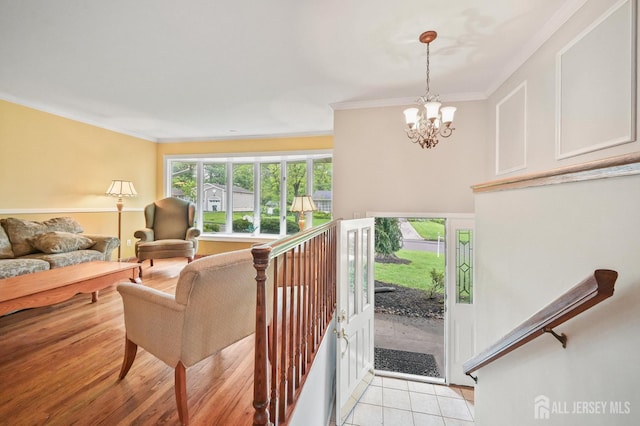 134 Devon Rd, Colonia, NJ 07067 - living area featuring ornamental molding, a chandelier, and light tile patterned flooring