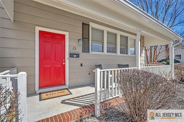 doorway to property featuring covered porch