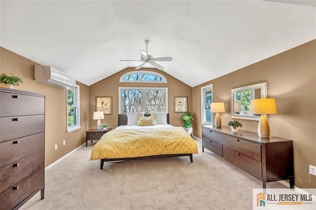 bedroom with a ceiling fan, light carpet, lofted ceiling, a wall mounted air conditioner, and baseboards