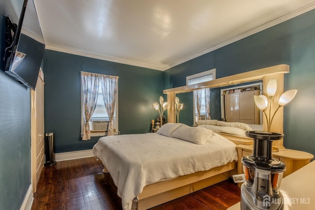bedroom featuring crown molding, baseboards, and wood-type flooring
