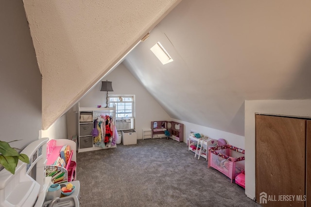 playroom featuring lofted ceiling, cooling unit, carpet floors, and a textured ceiling