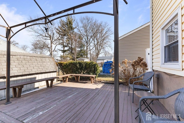 wooden deck featuring fence