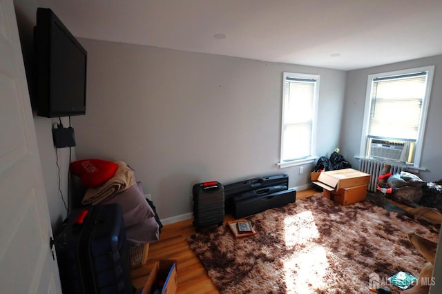 interior space with cooling unit and light wood-type flooring