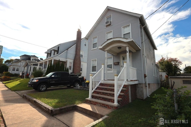 view of front of property with a front lawn