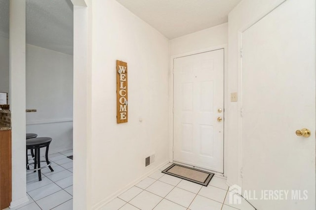 view of tiled foyer