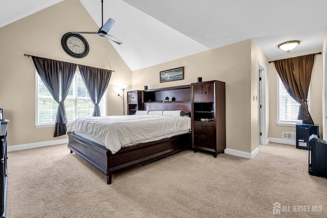 bedroom with light carpet, multiple windows, baseboards, and high vaulted ceiling