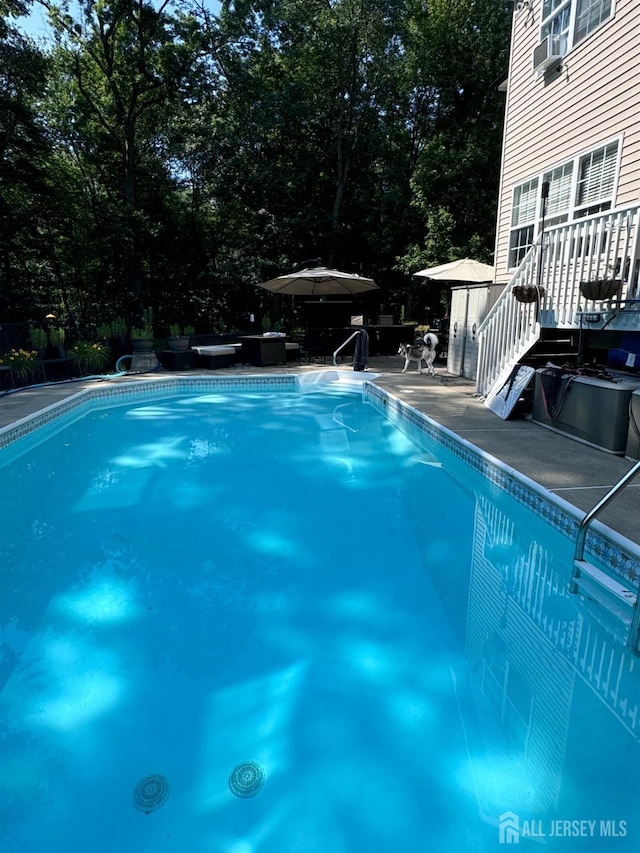 swimming pool featuring cooling unit