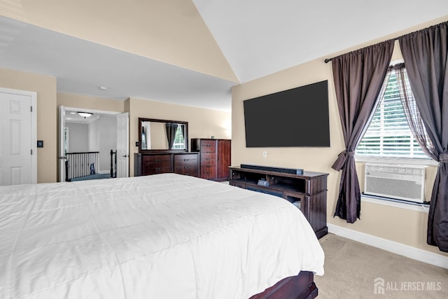 bedroom with lofted ceiling, baseboards, light colored carpet, and cooling unit