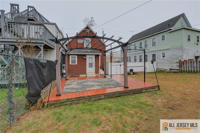 view of yard with an outdoor structure, a deck, and a pergola