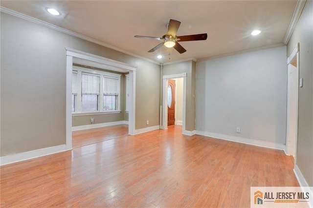 unfurnished room featuring ceiling fan, ornamental molding, and light hardwood / wood-style flooring