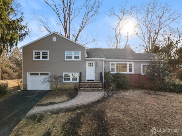 split level home featuring a garage