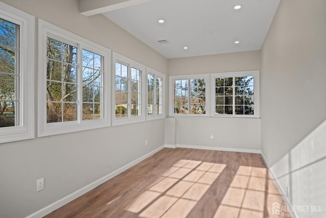 unfurnished sunroom with visible vents