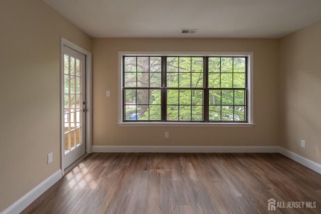 2708 Ridgefield Ct, Helmetta, NJ 08828 - spare room featuring plenty of natural light, wood finished floors, and baseboards
