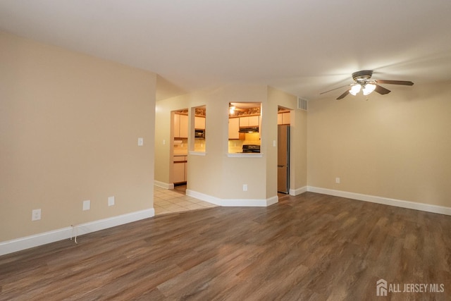 2708 Ridgefield Ct, Helmetta, NJ 08828 - unfurnished living room with ceiling fan, wood finished floors, and baseboards