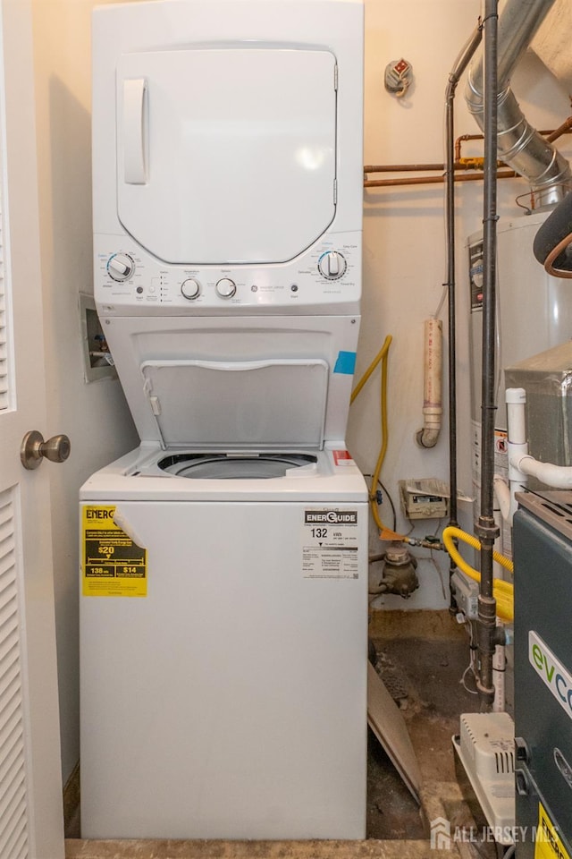 2708 Ridgefield Ct, Helmetta, NJ 08828 - laundry room featuring stacked washer and clothes dryer