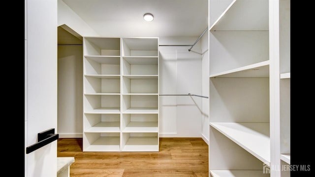 walk in closet featuring light wood-type flooring