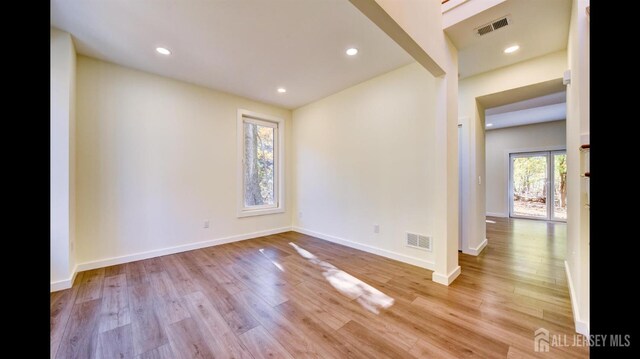 unfurnished room with light hardwood / wood-style floors