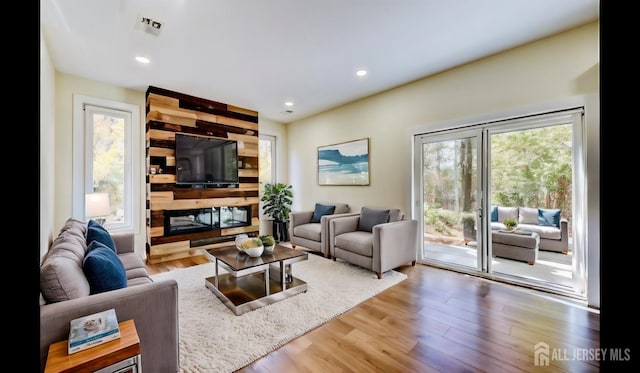 living room featuring hardwood / wood-style floors and a fireplace