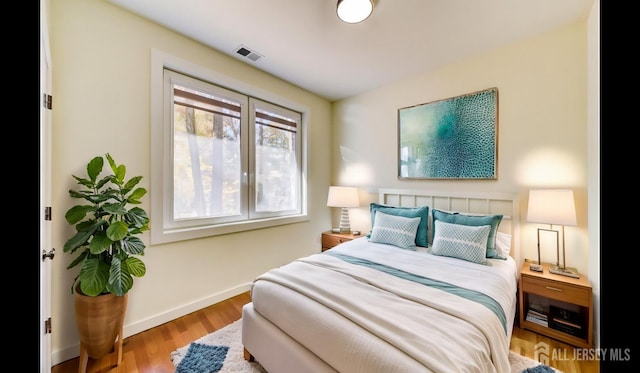 bedroom with light hardwood / wood-style floors