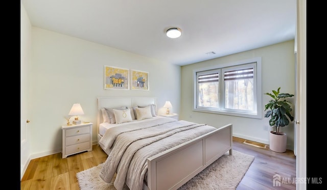 bedroom with light wood-type flooring