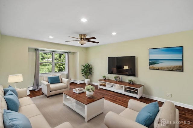 living area with recessed lighting, a baseboard radiator, wood finished floors, and baseboards